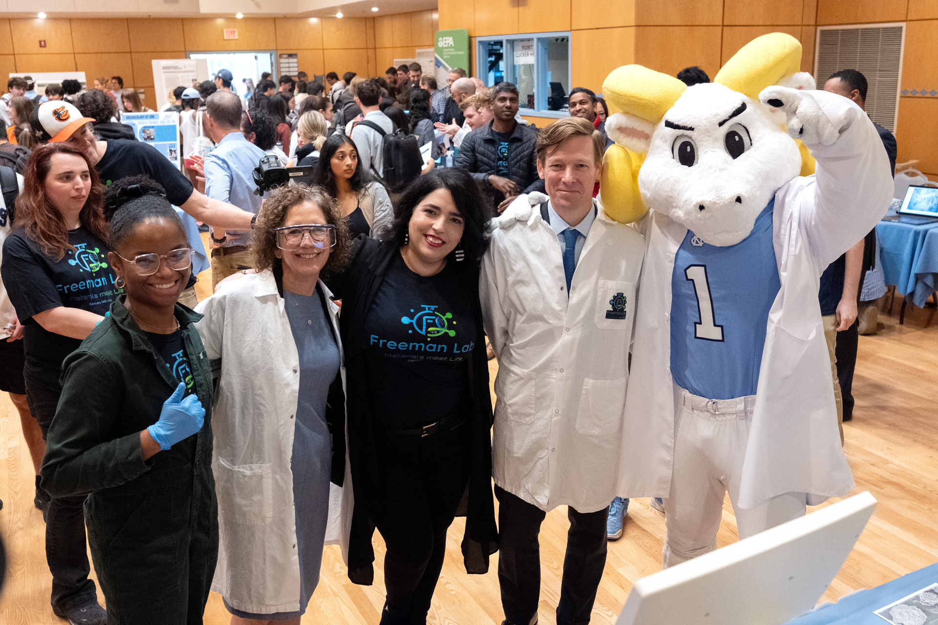 A group of female students pose with Chancellor Lee Roberts and mascot Ramses in the Frank Porter Graham Student Union.